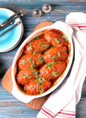 Lenten rice cutlets with onions, carrots, cabbage and mushrooms baked in tomato sauce.