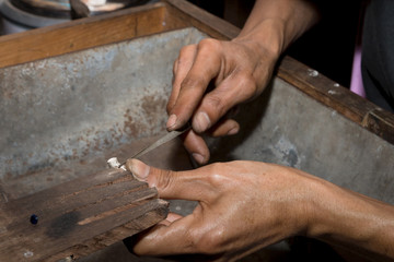 Master jeweler makes a ring of silver