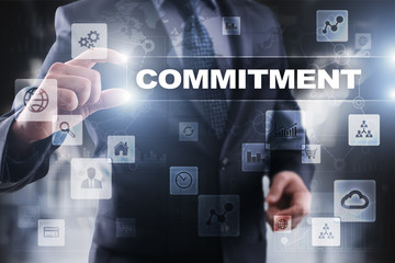 Businessman selecting commitment on virtual screen.