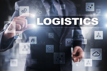 Businessman selecting logistics on virtual screen.