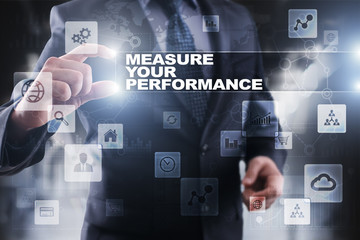 Businessman selecting measure your performance on virtual screen.