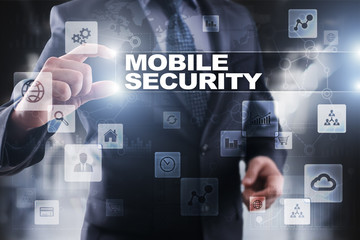 Businessman selecting mobile security on virtual screen.