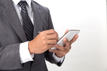 young asian businessman wearing gray suit using mobile smart phone with touch pen over white background