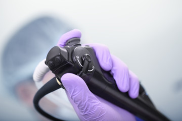 Bronchoscope in the doctor's hand during the procedure