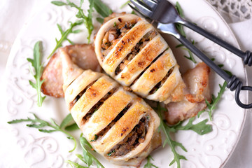 Baked squid stuffed with onions, carrots and mushrooms