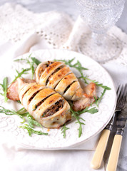 Baked squid stuffed with onions, carrots and mushrooms