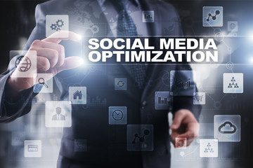 Businessman selecting social media optimization on virtual screen.