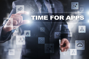 Businessman selecting time for apps on virtual screen.