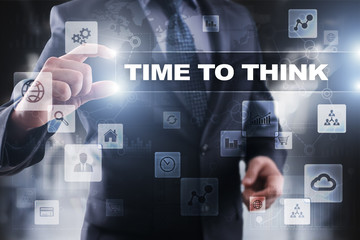 Businessman selecting time to think on virtual screen.