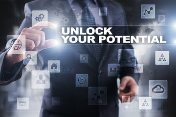 Fototapeta na wymiar Businessman selecting unlock your potential on virtual screen.