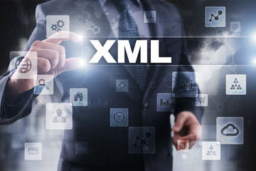 Businessman selecting xml on virtual screen.