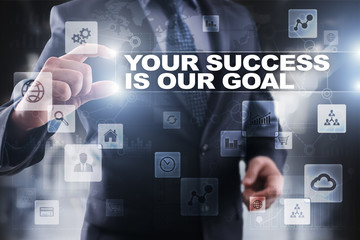 Businessman selecting your success is our goal on virtual screen.