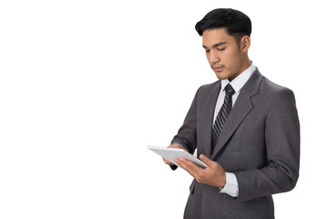 young asian startup entrepreneur businessman wearing gray suit using digital tablet touchpad over white background