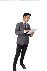 young asian startup entrepreneur businessman wearing gray suit using digital tablet touchpad over white background