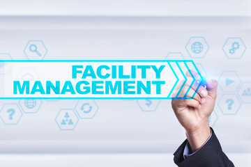 Businessman drawing on virtual screen. facility management concept.