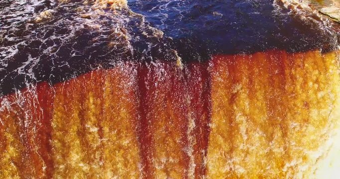 Springtime waterfall raging in Upper Michigan, this is upper Tahquamenon Falls, aerial view.
