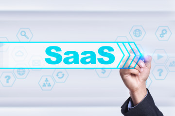 Businessman drawing on virtual screen. saas concept.