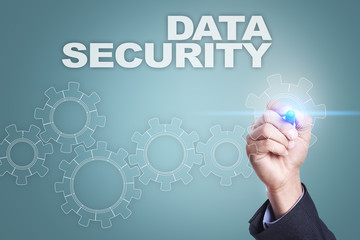 Businessman drawing on virtual screen. data security concept