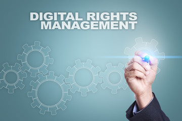 Businessman drawing on virtual screen. digital rights management concept