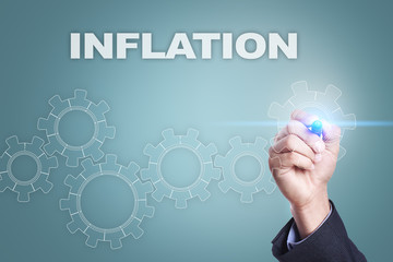 Businessman drawing on virtual screen. inflation concept