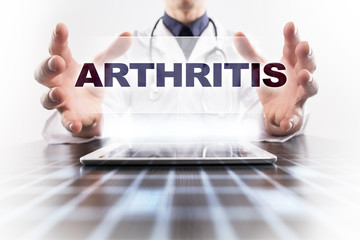 Medical doctor using tablet PC with arthritis medical concept.