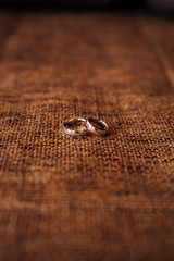 Obraz na płótnie Canvas Wedding rings on a textured background. Wedding in Montenegro