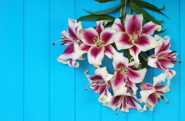  lily flowers on wooden planks