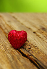 Obraz premium Red heart on a wood