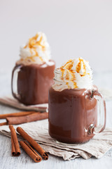 hot chocolate with whipped cream caramel in mason jar