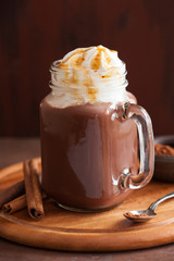 hot chocolate with whipped cream caramel in mason jar