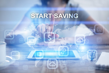 Woman using tablet pc, pressing on virtual screen and selecting start saving