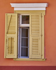 Fototapeta na wymiar vintage window house on colorful wall