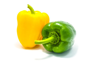 Yellow and green bell peper on white background.