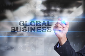 Businessman is drawing on virtual screen. global business concept.