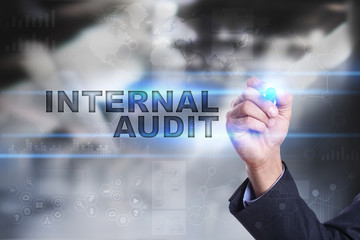 Obraz premium Businessman is drawing on virtual screen. internal audit concept.