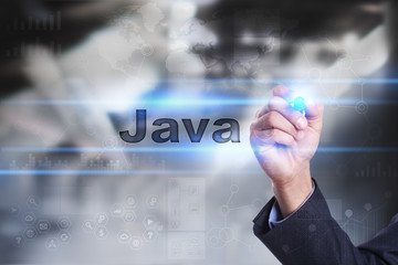 Businessman is drawing on virtual screen. java concept.