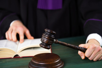 Judge in courtroom. Mallet and Scale