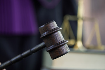 Judge in courtroom. Mallet and Scale