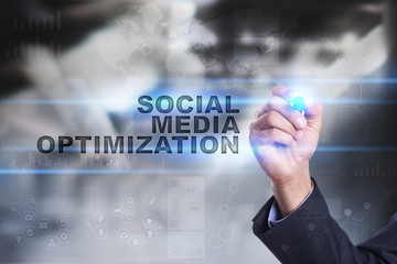 Businessman is drawing on virtual screen. social media optimization concept.