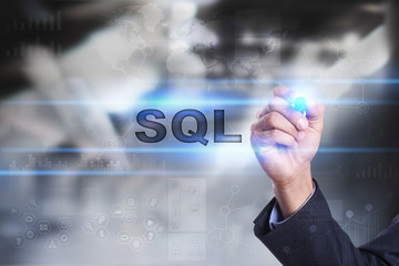 Businessman is drawing on virtual screen. sql concept.