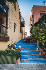 Rethymnon, Crete island, Greece. Cretan small street with stairs colored in blue.
