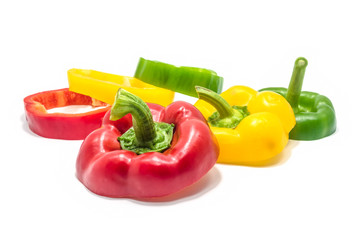 Red green and yellow slices of bell pepper isolated.