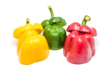 Green red and yellow slices of bell pepper isolated.