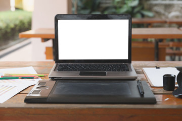 desk of graphic designer at work - digital tablet, computer, color swatch catalog samples for selection. Creativity Editor Ideas Designer Concept