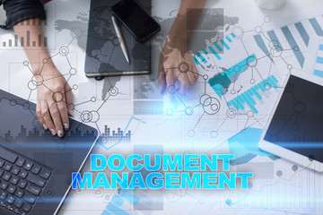 Woman working with documents, tablet pc and notebook and selecting document management.