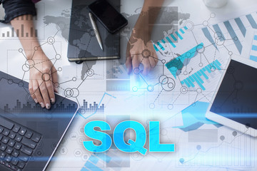 Woman working with documents, tablet pc and notebook and selecting sql.