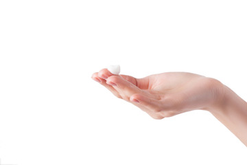 Perfect soft hands on isolated background with the drop of moisturizing cream on. young girl wearing hand cream