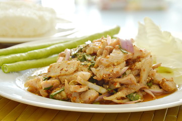 Thai spicy slice pork salad eat couple with sticky rice and fresh vegetable