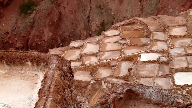  well known Maras salt evaporation pond in the Andes of Peru in the Region of Cusco (Cuzco). South America