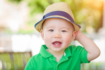 Portrait of A Happy Mixed Race Chinese and Caucasian Baby Boy Wearing His Hat